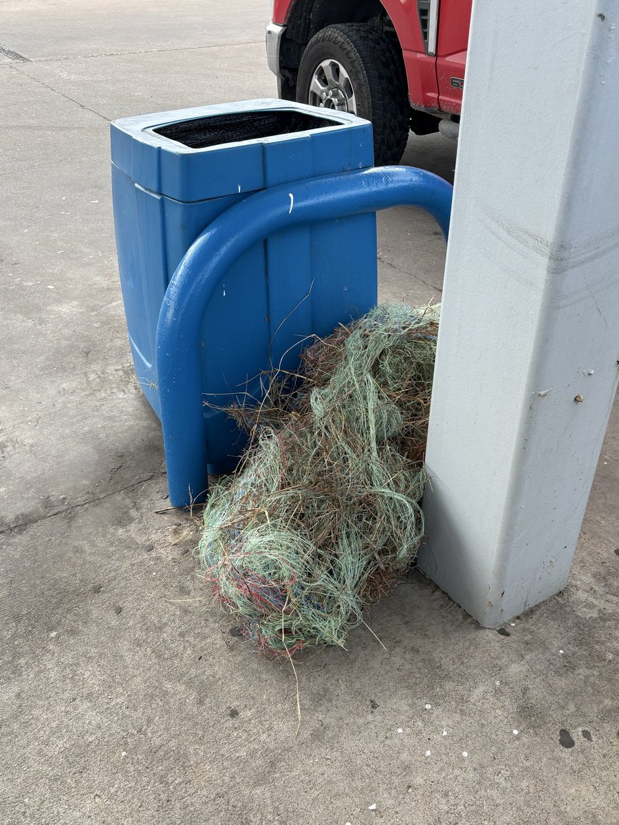 You’ve got to get out of town to see a pile of baling twine at the gas pump trash can…