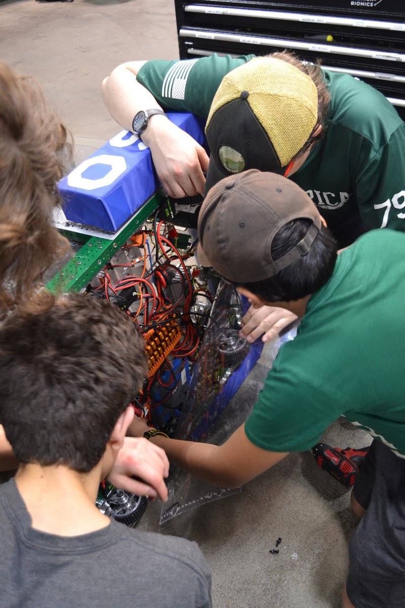 team4909's tweet image. DCMP load‑in with Team 4909! Our brand‑new robot, built just last week, is in the pit, wired up, and ready for its first big test. Time to see what it can do. 
 #omgrobots #FRC #nefirst #robotics #rebuilt