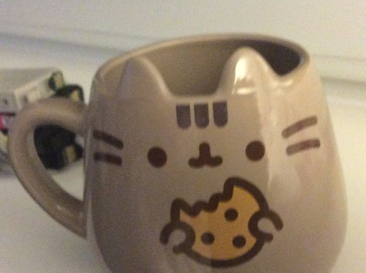 Pusheen parody account tweet media