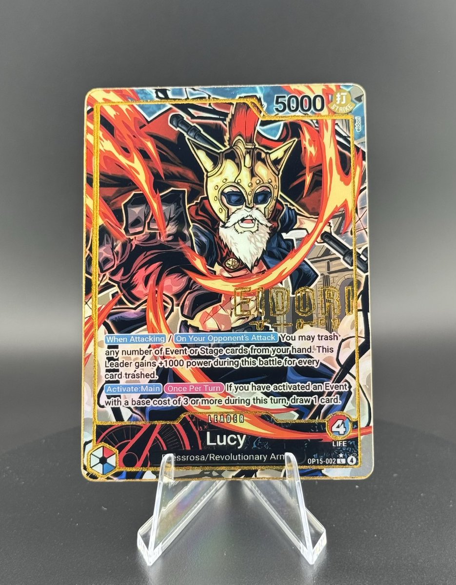 JollyRogerCards's tweet photo. Holographic OP-15 Lucy Leader is now available in our Etsy shop:

https://t.co/TGgstZ460x

Artwork drawn by @eidori___ 
All cards are available in three variants: Gold Foil Signature Limited Edition (available for a limited amount of time), regular gold foil, and no gold foil.

Please reach out on any of our socials if you have any questions or concerns!
#onepiece #optcg #tradingcard #customcard #onepiececardgame #sabo