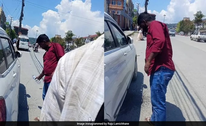 ndtv's tweet photo. Nepali Man Makes Indian Tourists Clean Gutka Spit From Street, Video Sparks Debate https://t.co/nmGlfnSKG9 https://t.co/pW5lUmejwy