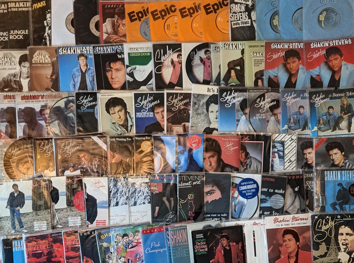 paultakeone's tweet photo. A photoshoot with me and my @officialShaky  Shakin' Stevens collection in the works for a magazine, I'll give more details when I can. It was nice dusting off my records from boxes to photograph, here's just a snippet. I forgot I still had so much stuff! https://t.co/06hhbIIT5J