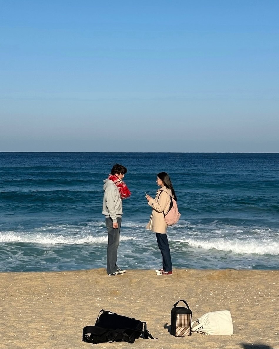 Between grains of sand and drifting tides, we found a language only the ocean understands, where every glance felt like a story carried far beyond the shore.