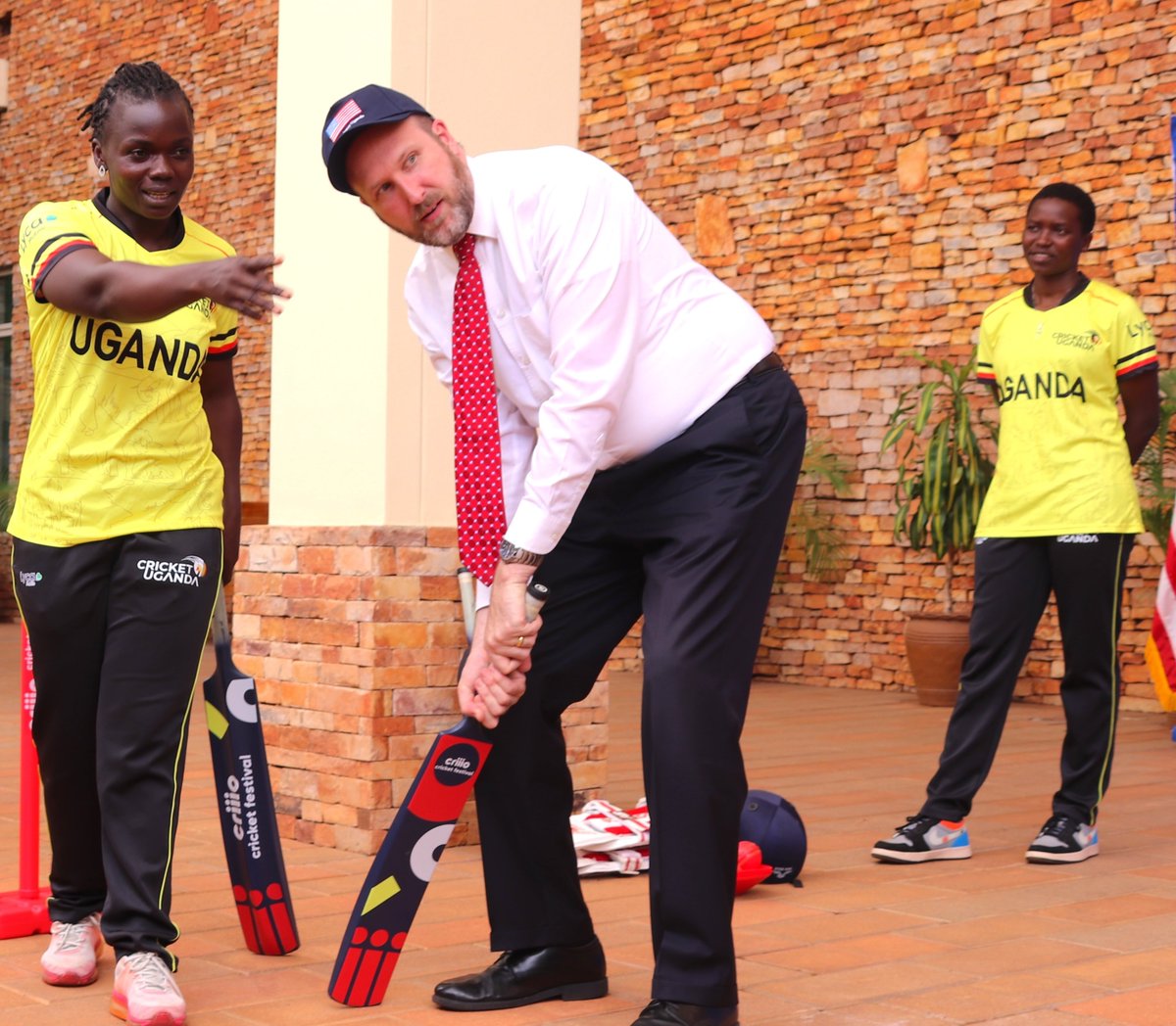 USEmbassyUganda's tweet photo. It was great to host the U.S. and Ugandan Women's National Cricket Teams at the U.S. Embassy! These athletes represent the best of #SportsDiplomacy embodying excellence, determination, and the power of sports to build bridges between nations. 
Wishing both teams success in the tri-series! 🇺🇸🏏🇺🇬  #DecadeofSport #Freedome250