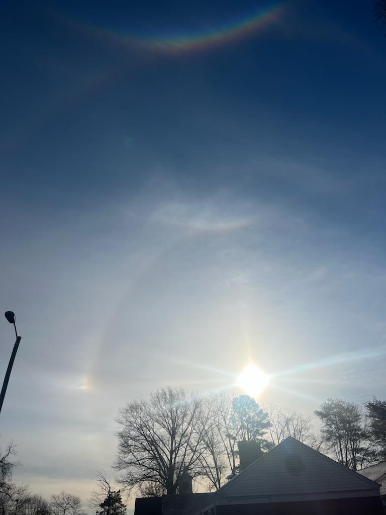 fchartier78's tweet photo. Thought I'd share a recent photo my wife took - it looks like it includes 2 solar circles (one faint under the top most rainbow) second clearly around it... then rainbows arching both ways at their peaks - don't really see sideways rainbows that often... think there are 3 in there. Don't normally see rainbows in front/ facing the sun either.