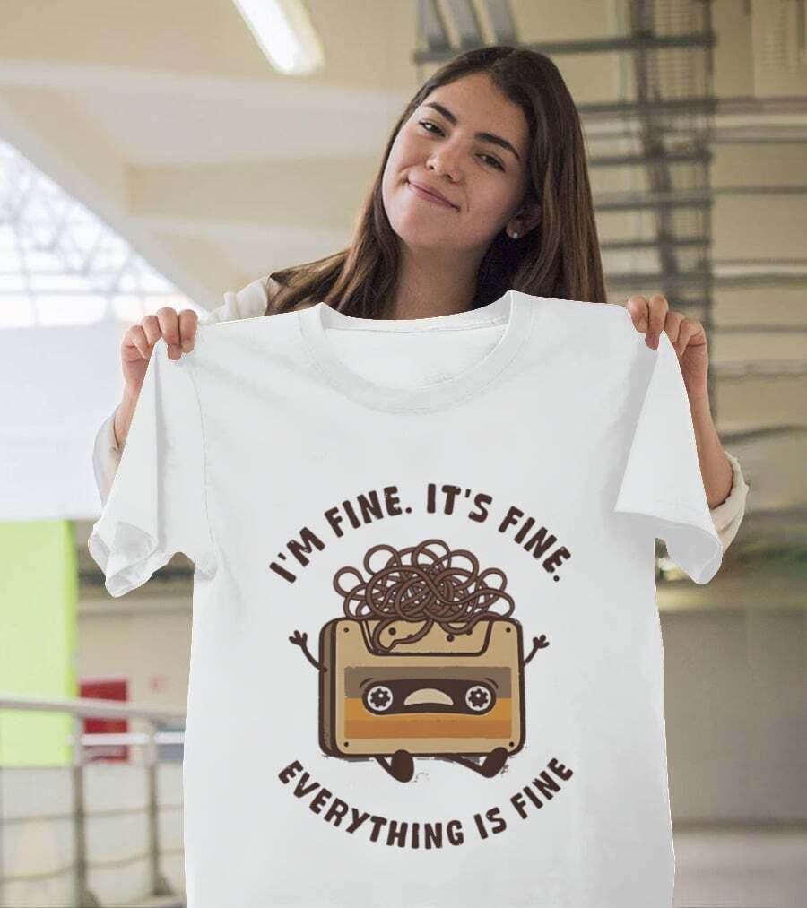shirtkaya's tweet photo. Hear me out: this "I'm Fine It's Fine Everything Is Fine" cassette tape tee brings back all the retro vibes! It's like a cozy hug for your wardrobe. https://t.co/zrdISClMdP

#RetroHumor #Nostalgia #CassetteTape #Tshirt https://t.co/7B6hp9aaA4