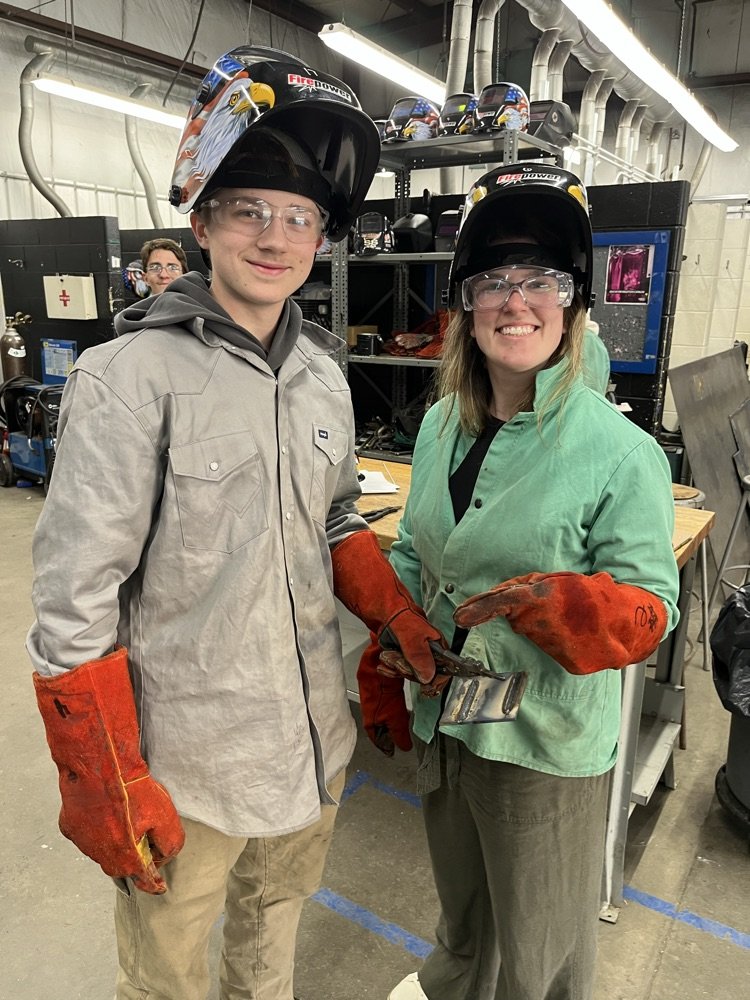RushvilleHigh's tweet photo. Mrs. Meek hung out with the Ag Power students today! Wyatt taught Mrs. Meek about stick welding (which she says is VERY difficult). Kids are getting great experiences at RCHS! #lionsleaveitbetter https://t.co/UH2pZV2Zbo
