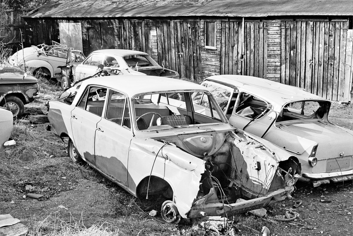HighlandHistory's tweet image. Cars, most looking like they're ready to be scrapped, at 59 Argyle Street, #Inverness in April 1978. Argyle Car Sales operated from here in the second half of the 1970s before relocating to Glenurquhart Road in 1981.

[photos: Ken MacKenzie / @highlandcouncil]