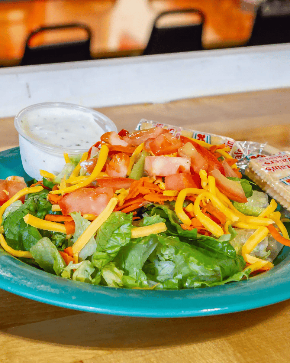 Gaslight_Pizza's tweet photo. Looking for something fresh and simple? Our House Salad is made with a crisp iceberg-romaine mix, shredded carrots, cheese, and fresh diced tomatoes. It's a perfect, light start to any meal. Add one to your order tonight! https://t.co/Vvw10SA9HL https://t.co/JnY8F6Qpe8