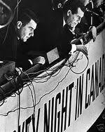 Remembering_pod's tweet photo. On this day in 1917, legendary hockey voice Danny Gallivan was born. Episode 42: #Remembering Mr. Gallivan with Paul Romanuk & our host @JeffSammut. Listen on https://t.co/tRJLSO4u0g, your favourite podcast platforms & check out https://t.co/pTU7TYp6eT. #dannygallivan #NHL https://t.co/rrKns8WTbM