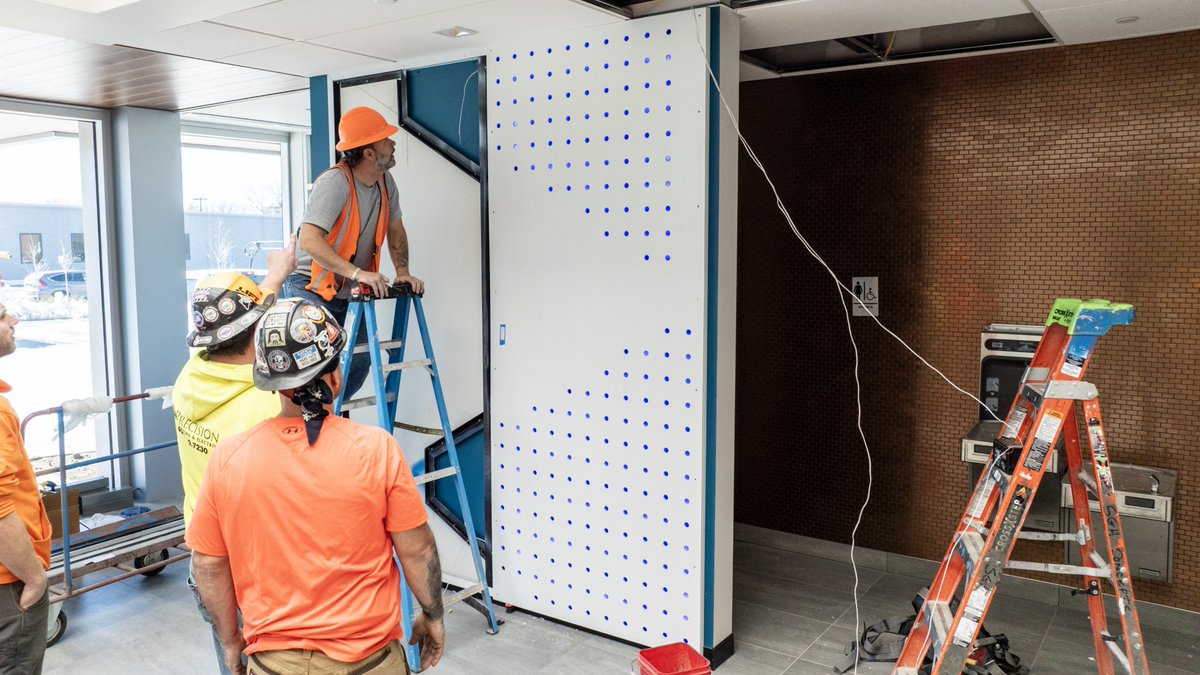 SGHconcepts's tweet photo. Featuring: Fiber-Cement Panels
Used on both the exterior &amp; interior of our new Omaha facility, #fibercementpanels deliver durability, texture, &amp; design flexibility. Highlighted by a perforated, backlit SGH logo wall in the atrium, this system shows its versatility! https://t.co/IZTgd5x7ix