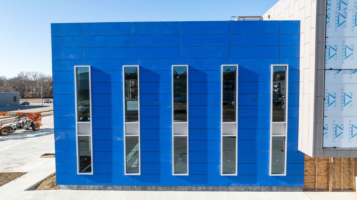 SGHconcepts's tweet photo. Featuring: Fiber-Cement Panels
Used on both the exterior &amp; interior of our new Omaha facility, #fibercementpanels deliver durability, texture, &amp; design flexibility. Highlighted by a perforated, backlit SGH logo wall in the atrium, this system shows its versatility! https://t.co/IZTgd5x7ix
