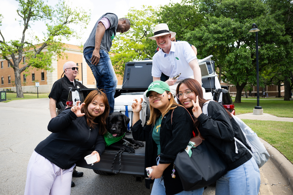 UNTPrez's tweet photo. Today at @UNTsocial, I was honored to walk with the Police Department's comfort dog, Clover, as we delivered ice cream across campus for our UNT community. It was also a nice break for Clover from her usual popcorn treats at Paw-fice hours in the President's office. #GMG https://t.co/92iMAmOzcy