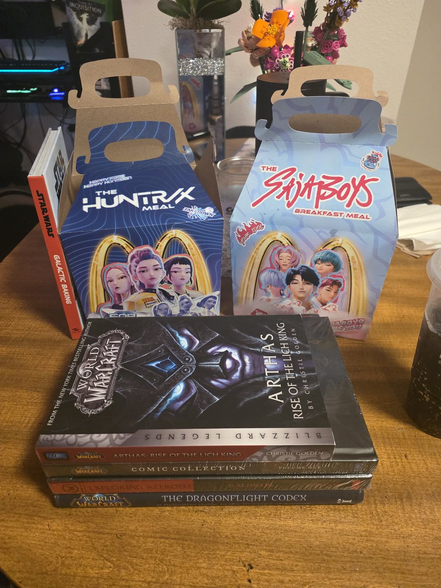 EasiestZebra's tweet photo. Nothing says grown ass man like getting huntrix meals with kpop DH music blasting, followed by going to a comic store and getting $135 of wow lore books in your pajamas. https://t.co/yMsMbxep1F