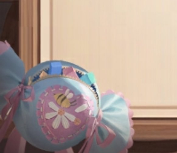 SoupRadish's tweet photo. @loafofbreadaj Besides from border deco, I'm just curious who approved for the (clearly) ai bag design? The bee plucked off a petal and sat on the broken flower? Annie needs childrens play blocks in her bag? https://t.co/jOw3JlIuqK
