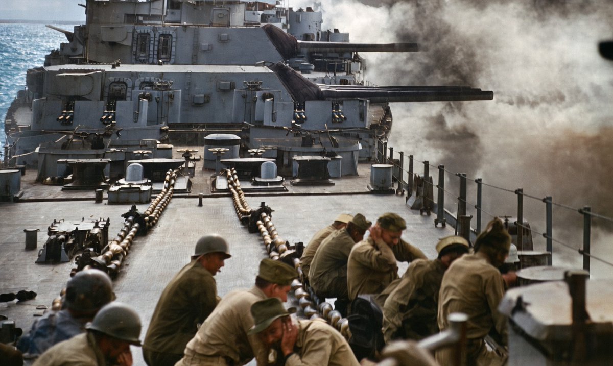 EpochsOfEngines's tweet image. Photo from the The Hampton Roads Naval Museum website, which I colorized with Grok.

"Personnel take cover on the forecastle of the battleship Wisconsin (BB 64) as the main batteries commence firing in 1945 as published in The Badger, Wisconsin's newspaper."