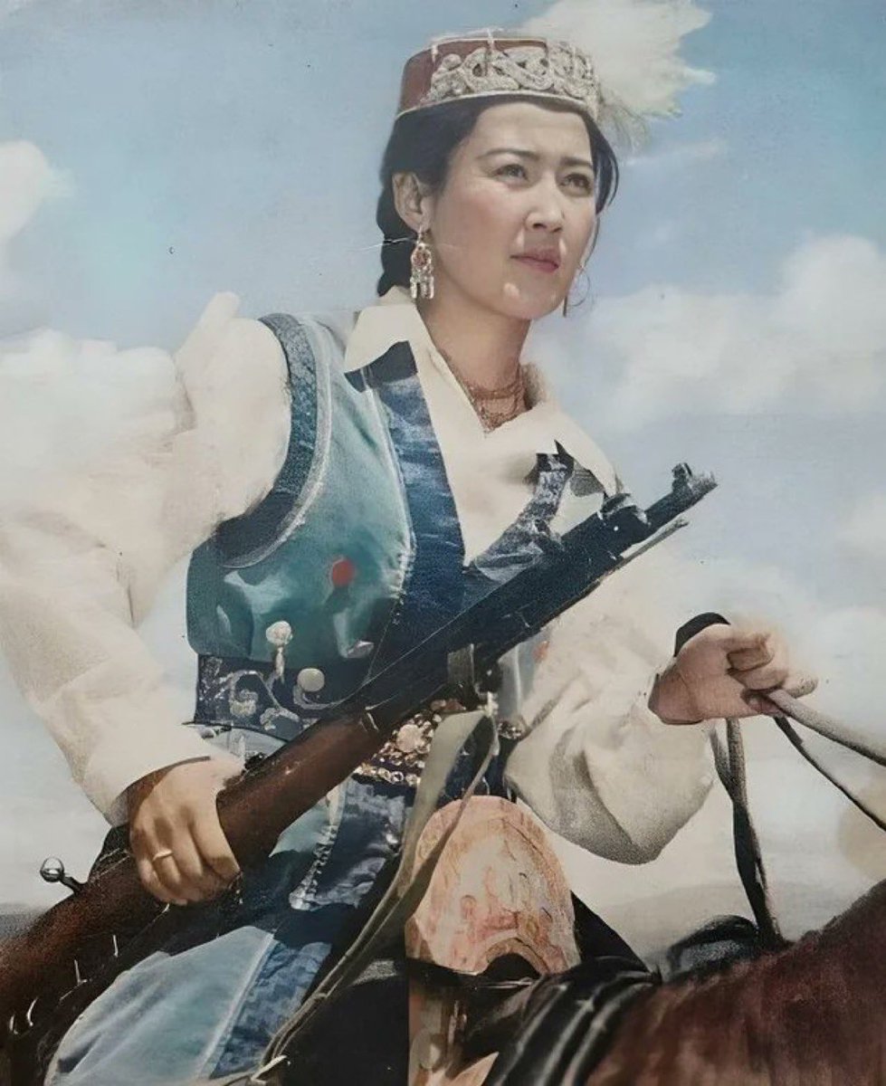 ExplorerMoment's tweet image. Armed Kazakh Woman on the Steppes of Western China, 1982.