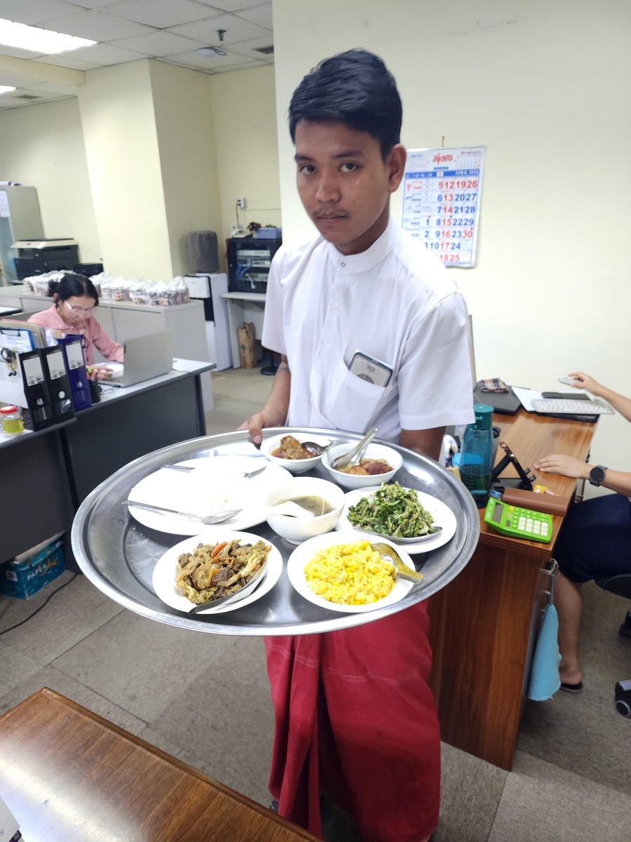 yangonow's tweet photo. 本日、ヤンゴン事務所は仕事納め！

明日から正月休暇で9連休🌸
そして来週17日、ミャンマー生活30年を迎えます。
1996年、UB222でヤンゴンに降り立ったのがスタートでした✈️

今日は感謝を込めて、社員の皆さんに人気の「Khaing Khaing Kyaw」のミャンマー料理をケータリング。学校のイベントルームが一気にレストランに😊

これからもよろしくお願いします🙇‍♂️