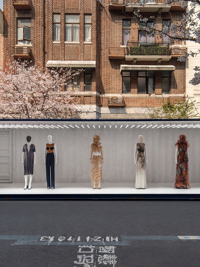 designboom's tweet photo. shipping containers frame @Margiela's shanghai exhibition by OMA / AMO https://t.co/aRY9G20LjM https://t.co/bBV2Z3guUM