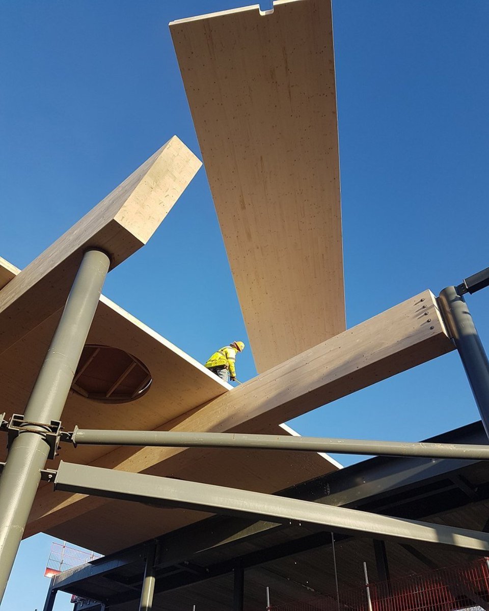 BucklandTimber's tweet photo. #CLT takes a simple idea and makes it structural. By layering timber at right angles, panels gain strength in both directions - ideal for large floors and walls, delivered to site ready to install. Used here at Wellington Academy to form a two-storey atrium ceiling. https://t.co/QlaZCIvIzU