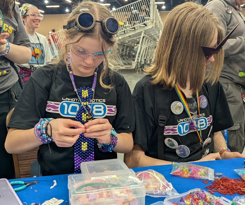 LakotaRobotics's tweet photo. If you’ve ever been to a regional with Lakota Robotics, then you know Mama Saunders! 💙✨

She brings everything needed to make earrings, bracelets, keychains—you name it! We love Mama Saunders!

#FIRSTRobotics #STEM #MoreThanRobots #RoboticsLife #lakotarobotics #omgrobots https://t.co/SNrBhmh0t8
