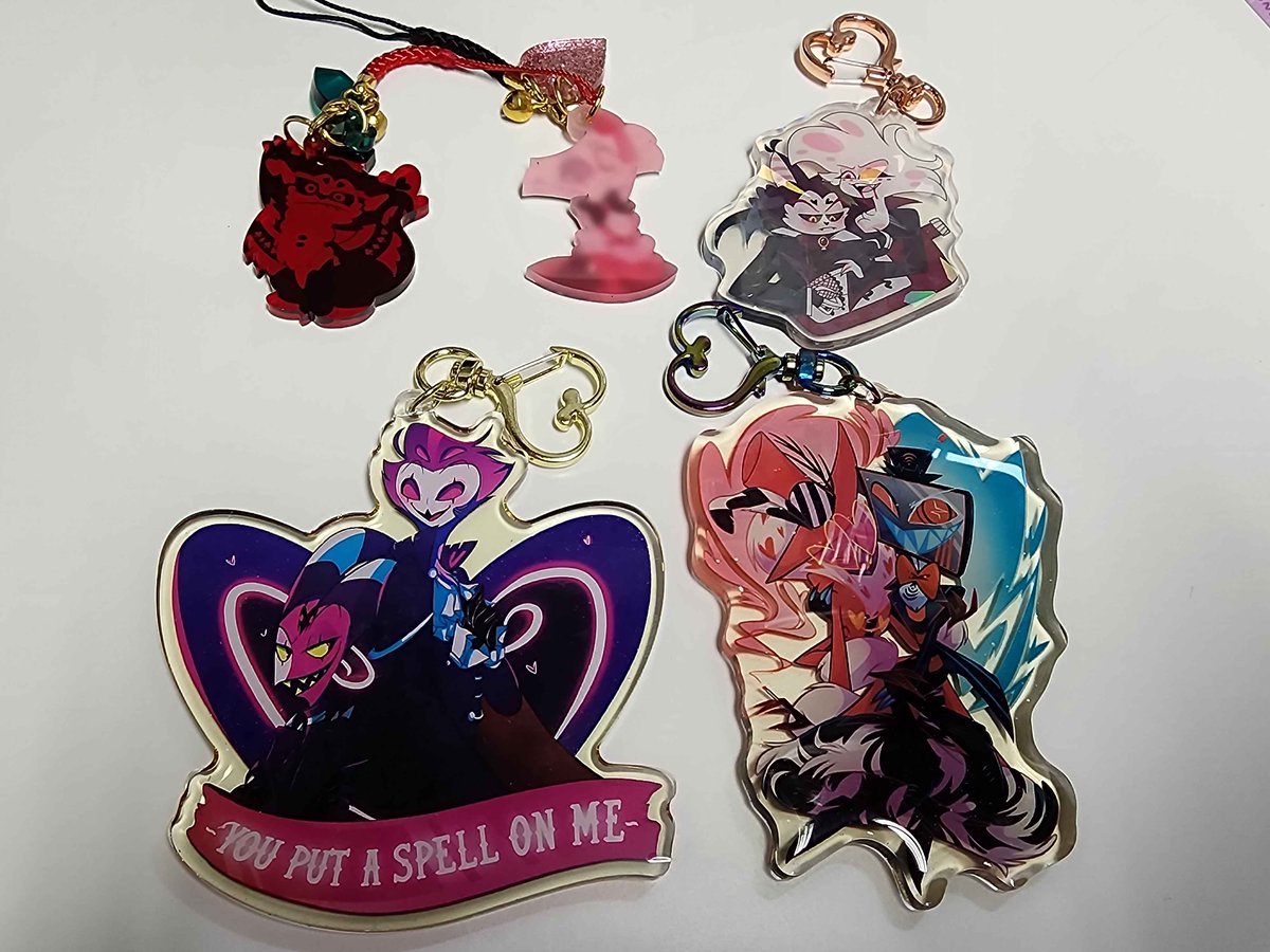 ObsessedKTMerch's tweet photo. Some acrylic keychains for sale.  In great condition.  The #stolitz and #angelhusk ones still have the protective film.  The #voxval one is double sided glitter.  See prices below and DM if interested. #hazbinhotel #helluvaboss https://t.co/gUlnOD7qye