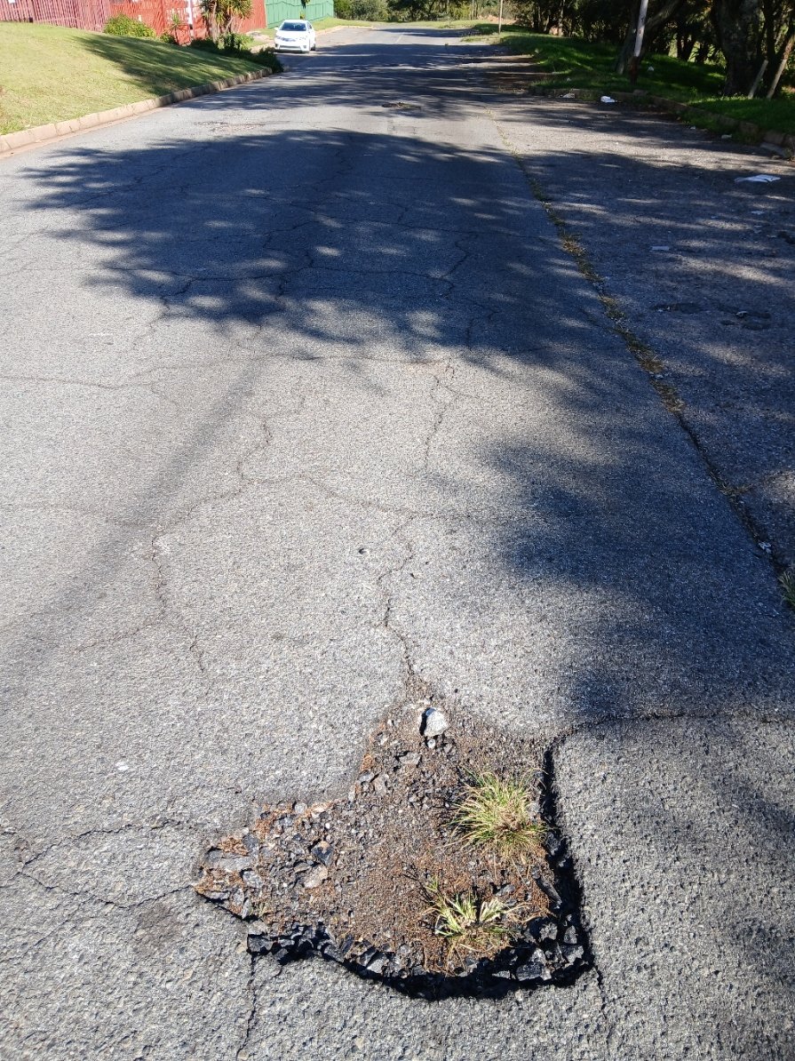 tgroe's tweet photo. @MyJRA ref: 5634222 Dangerous conditions of Lelie St Florida Park, Roodepoort. The portion linking with Daniel Malan is the worse. Vehicles needing to swerve to avoid the potholes, causing a major risk of head-on collision. https://t.co/Ct61z7w4JG