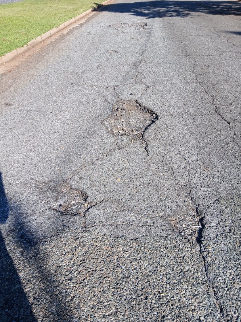 tgroe's tweet photo. @MyJRA ref: 5634222 Dangerous conditions of Lelie St Florida Park, Roodepoort. The portion linking with Daniel Malan is the worse. Vehicles needing to swerve to avoid the potholes, causing a major risk of head-on collision. https://t.co/Ct61z7w4JG