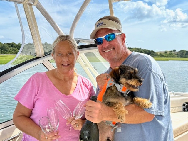 GradyLife's tweet photo. Treasa and Kevin Guilfoyle celebrating the delivery of their Freedom 255 in Beaufort, NC. Congrats! https://t.co/VPYuJPKaCu