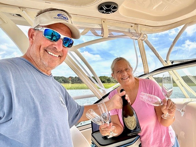 GradyLife's tweet photo. Treasa and Kevin Guilfoyle celebrating the delivery of their Freedom 255 in Beaufort, NC. Congrats! https://t.co/VPYuJPKaCu