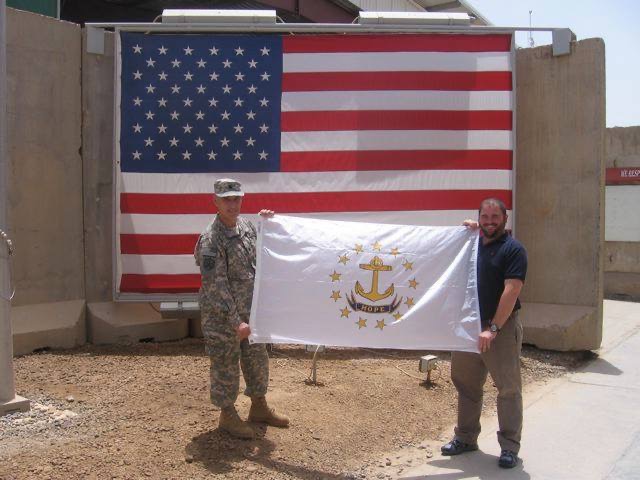 LoughlinRI1's tweet photo. When I was in Iraq in 2011, I met a fellow Rhode Islander named Greg Moore — a government employee from Cumberland, RI, detailed over there. I’d brought a Rhode Island flag along, and we posed with it in the blistering Baghdad heat.This past Wednesday evening I ran into Greg at the 2A rally at the Statehouse. First time we’d seen each other since Iraq.First photo: us with the RI flag in Baghdad.
Second: us at the Statehouse this week.
Final: my daughter Victoria with the very same flag during her tour in Iraq in 2017.A flag with a story to tell! 🇷📷
🇺🇸
