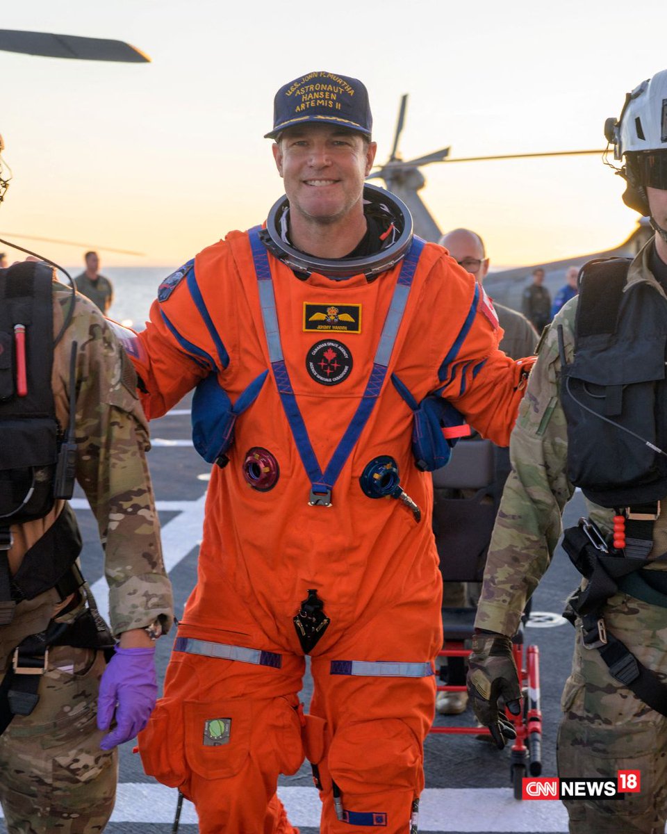 CNNnews18's tweet image. Artemis II crew members pose for the camera aboard a Navy MH-60 Seahawk after splashdown recovery on the USS John P. Murtha in the Pacific Ocean.

#ArtemisII #NASA #SpaceMission #OrionSpacecraft #Splashdown #SpaceExploration #Astronauts