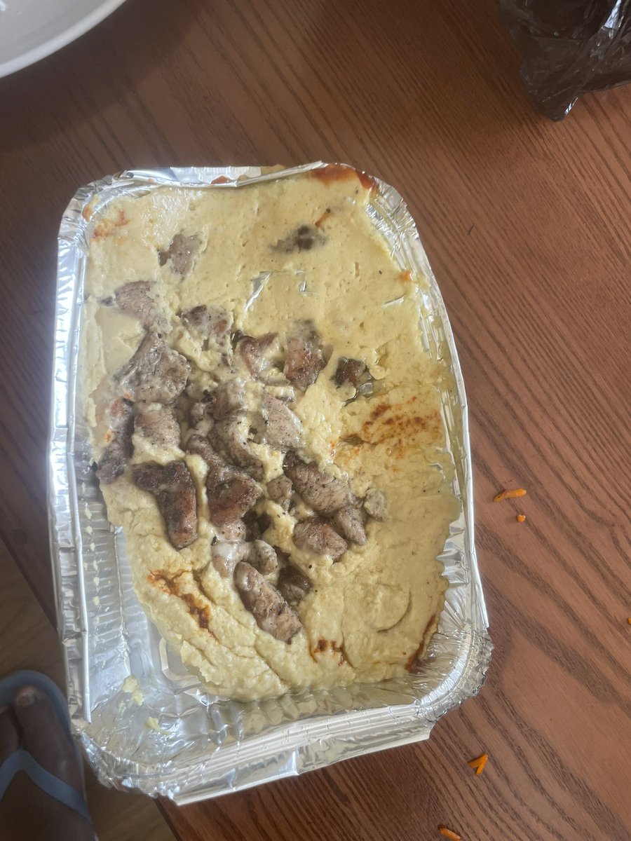 AmDic's tweet photo. @DeliverAddis Imagine this is how you deliver food! This is so disgusting and disappointing! All smashed and spilled, one wonders even how to pull it out! Delivered with a person wearing sandles with dusty feet! Who does this in this age and exposure? Why do you pack food in black plastics? https://t.co/87TMDt0qAJ