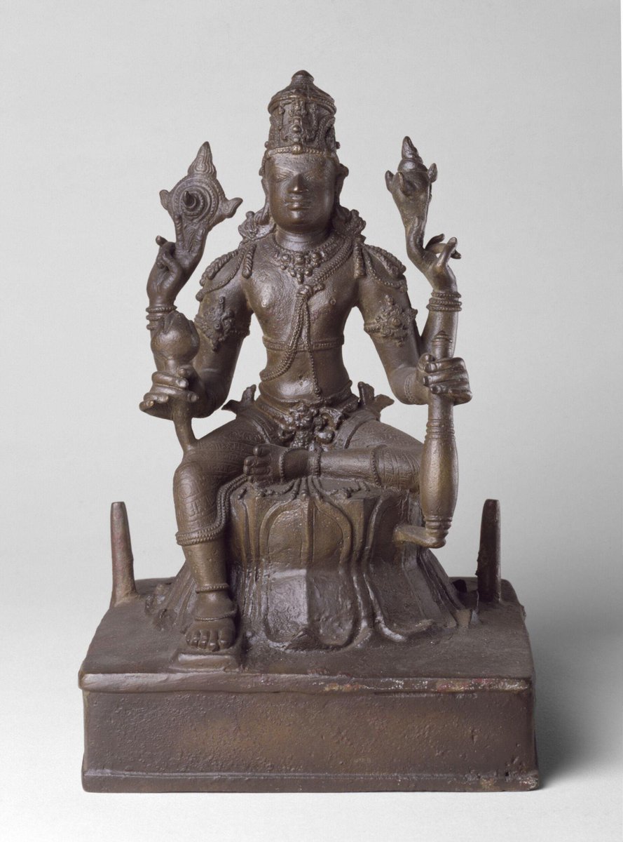 Viṣṇu seated in lalitāsana, copper alloy
Kancipuram, Tamil Nadu, 9th-10th century