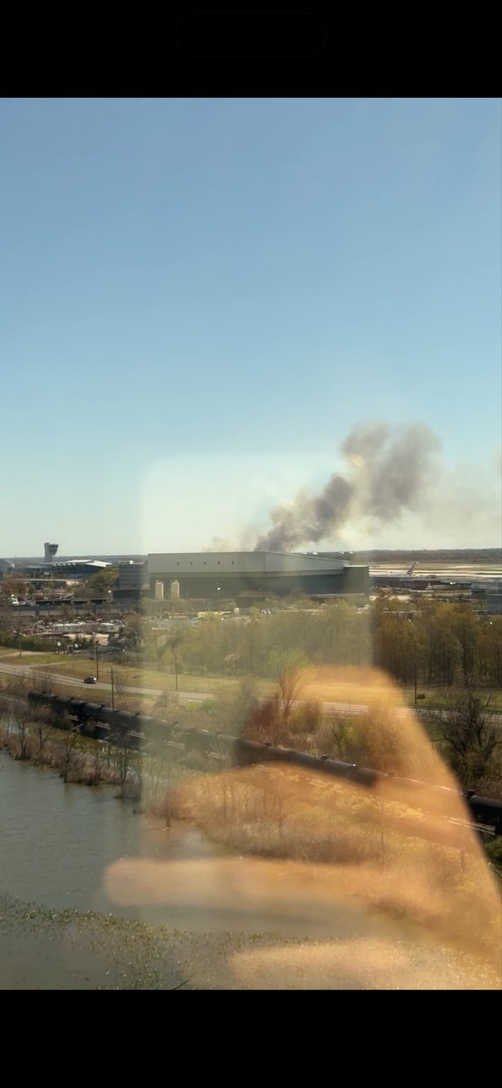 AronSegal's tweet photo. Last thing I see before leaving my hotel in Philadelphia. 

Wild.

Airport seems to be on fire from this angle https://t.co/2rN7GNxBg0