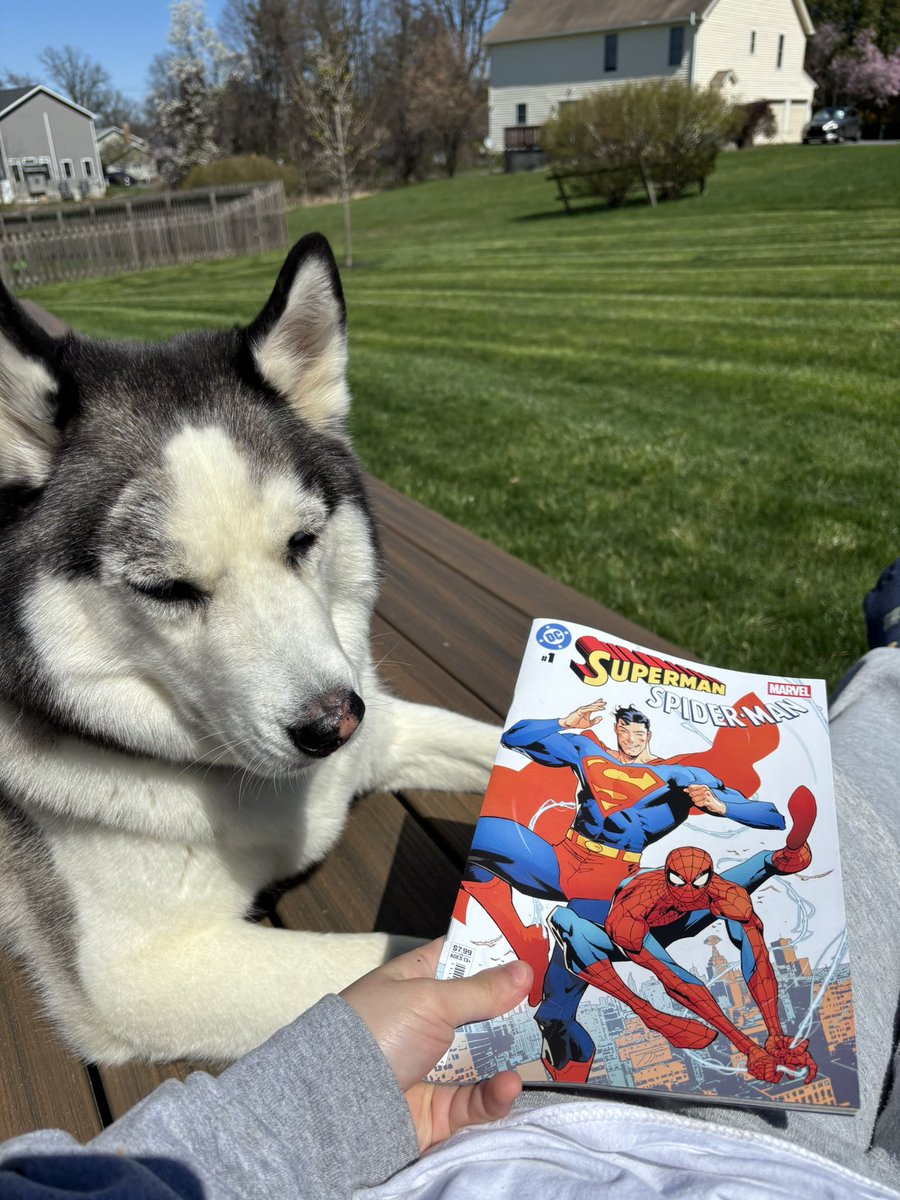 reading superman x spidey with my chud son in the sun