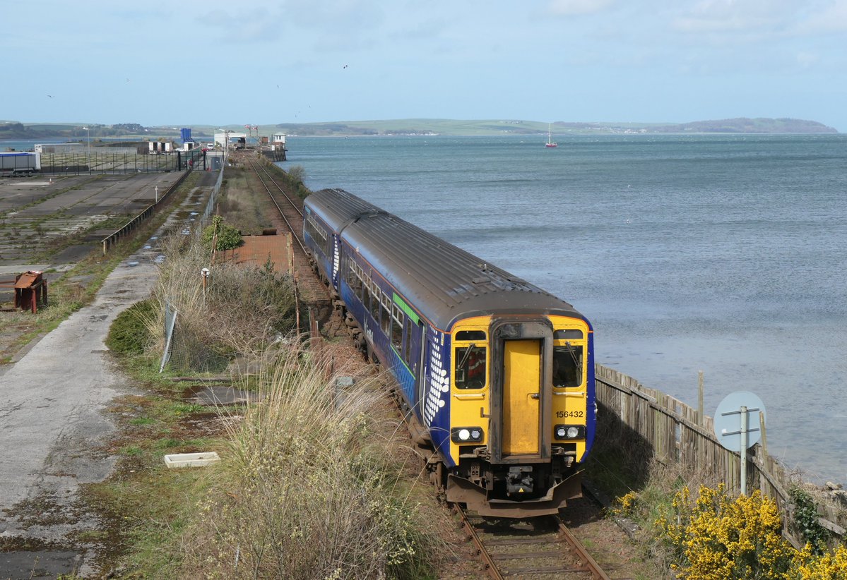 Scotrail Saltire liveried 156432 departs Stranraer with 1A63 13.05  service to Ayr 11.4.26. The remains of the abandoned former ferry  terminal are to the left of the shot. scottishtrains.zenfolio.com/p604331348/e54…