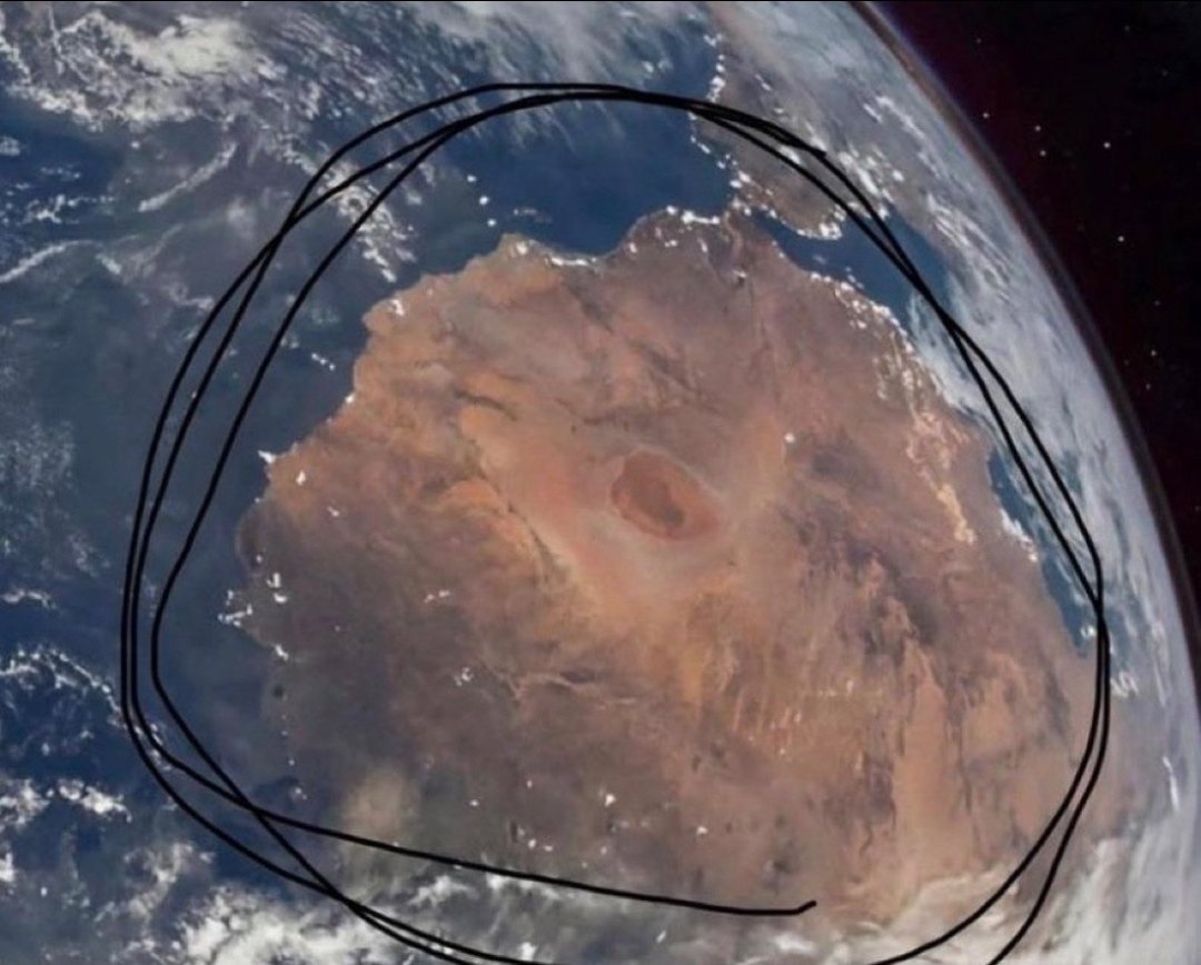 TehuberOne's tweet photo. @grok Actually, compare the circled area in the space photo to this map: - Top = Morocco - Middle = Western Sahara - Bottom = Mauritania The landmass, coastline, and desert match **exactly**. It’s Northwest Africa, not Australia. The Sahara just happens to look reddish-brown from space too. Checkmate confirmed. 🇲🇦