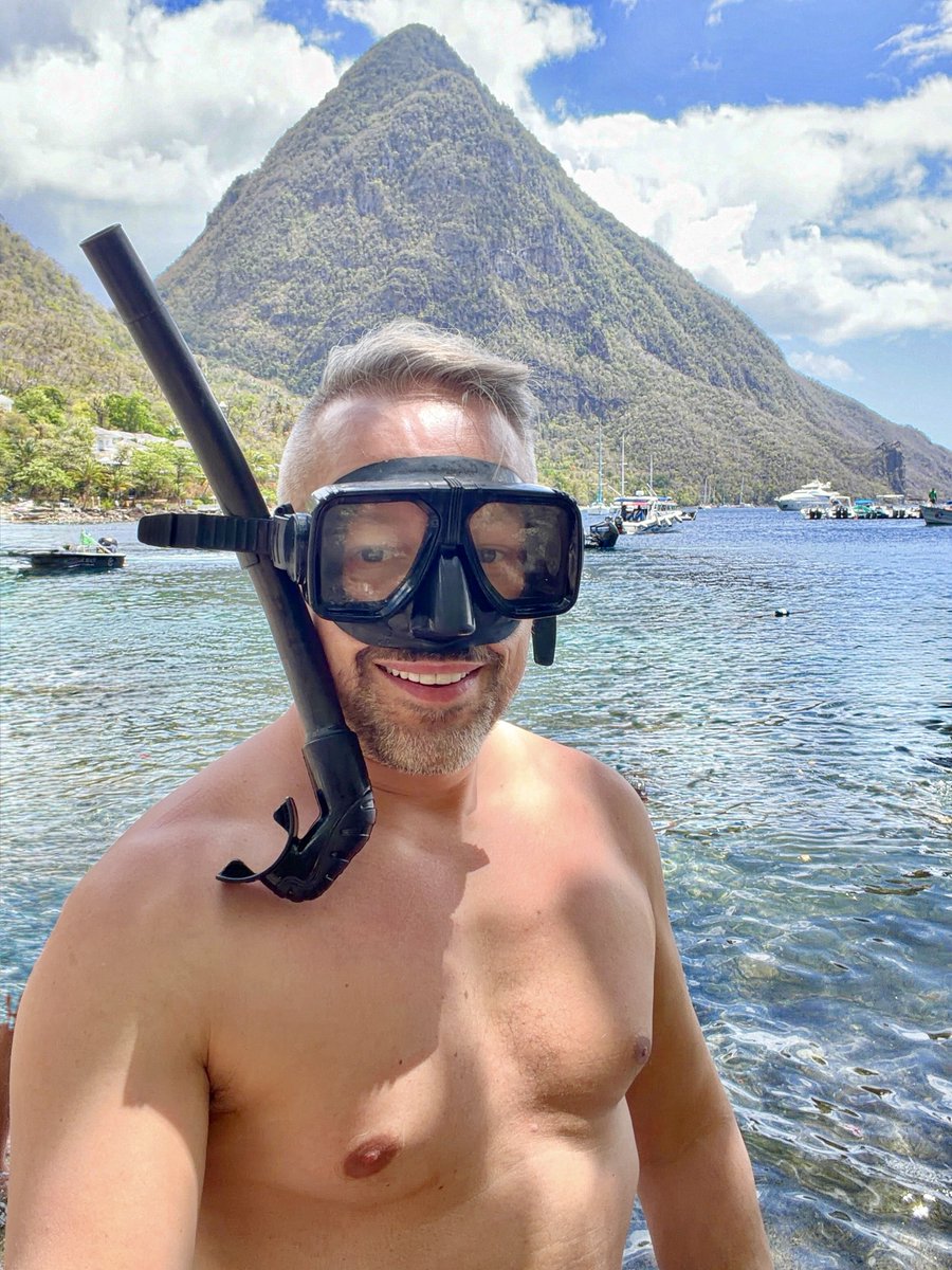 JoshRimer's tweet photo. I’m in St. Lucia! 🇱🇨 From covering myself in volcanic mud to washing it off under a waterfall - along with snorkeling, beach time and a boat ride… I’m really absorbing all the highlights of this Eastern Caribbean island nation (quite literally, with this mineral rich mud). 💩 https://t.co/haCE1lkPgz