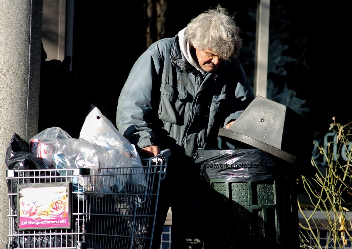 RealWorldImage's tweet image. A homeless man looks for useful items as the sunsets over New Westminster, British Columbia, Canada. Gary Moore photo. Real World Photographs. #streetphotography #Canada #photojournalism #NewWest #Nikon @NikonCanada #realworldphotographs #garymoorephotography #poverty #BC #Grok