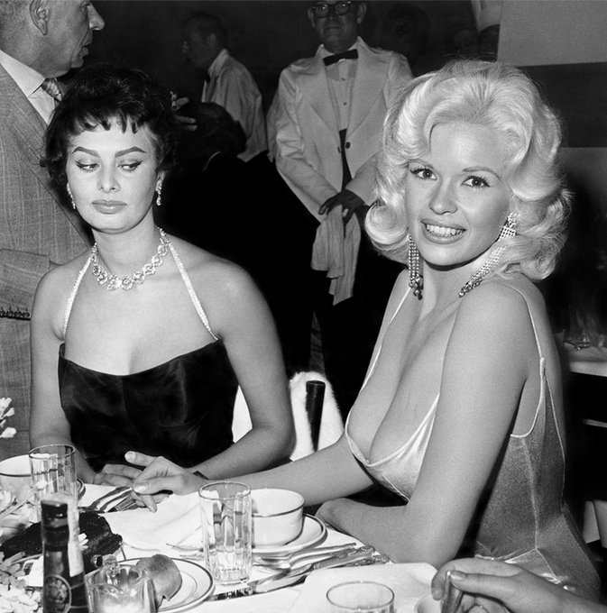 Noirchick1's tweet image. #OTD -April 12 in 1957, Jayne Mansfield, a genius at publicity stunts, attended a dinner at Romanoff's to officially welcome Sophia Loren to Hollywood.
The famous side-eye photo became instant legend...