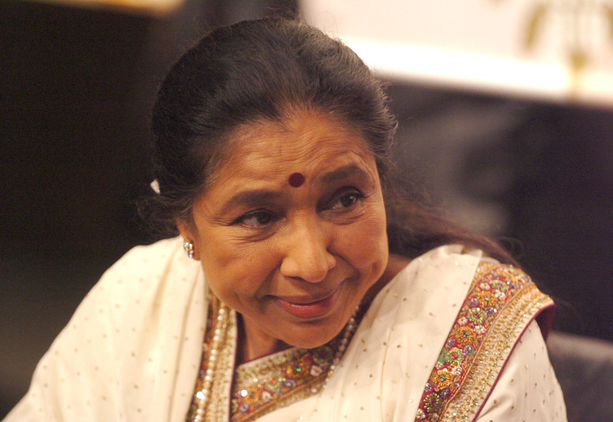 RIP Asha Bhosle, one of India’s most iconic and versatile voices, has left an indelible mark on music across generations. With a career spanning decades and thousands of songs in multiple languages, her voice brought life to melodies ranging from classical to contemporary. Her