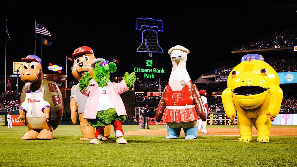 Alexcoll_'s tweet photo. BREAKING NEWS: Report #Phillies 

The Phillie Phanatic and his “Galápagos Gang” had to be escorted out of the venue while celebrating the 48th birthday of the famed mascot.

One report states prior to the lash out, #Phillies play by play announcer John Kruk was seen in a shoving match with Gritty, before being escorted out of the back door. 

Witnesses say the “Galapagos Gang” consumed the entire stock of raw & cooked meats, ignored multiple warnings, and when the owner of the disclosed restaurant issued a final warning, the green “Phanatic”  responded by shooting his extended tongue directly into her face. The cops were called. More to come.