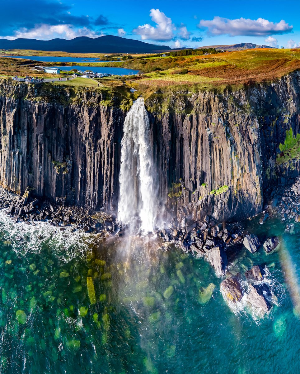 CMFMag's tweet photo. An amazing aerial view depicts the unbelievable Kilt Rock Waterfall cascading over seaside cliffs in our #SightSeeingSunday picture of the week. The Kilt Rock Waterfall is located on the picturesque Isle of Skye in Scotland. 

Have a happy Sunday!

https://t.co/GTAPlKhYqj https://t.co/5y7r90g5Wx