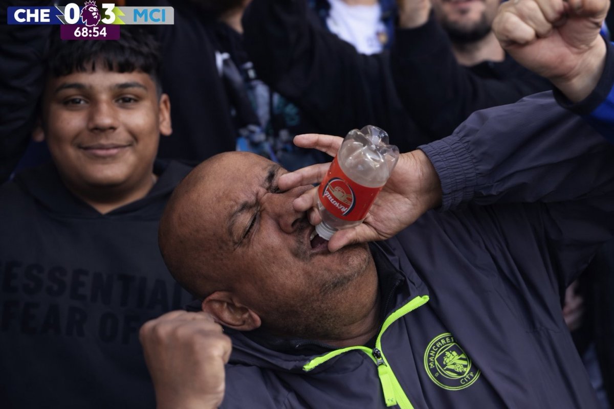Score9app's tweet photo. In football slang, bottled means: Choking under pressure, collapsing when it matters most in title races or big games.   

During Man City 3-0 Chelsea, a City fan waved an #Arsenal bottle to mock them live on camera. It’s now the iconic meme of 2025/26 #PremierLeague 

#Bottled https://t.co/Bn4mozG9px