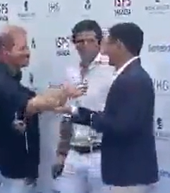 F*cking WEIRDO Prince Harry trying to nipple-twist one of the Sentebale donors.  Spoiler:  Donor was having NONE OF IT and has to physically push H's hand away.  No one is allowed to have boundaries in Harry's world.   Remember his prize line for Markle, she lets me do anything.