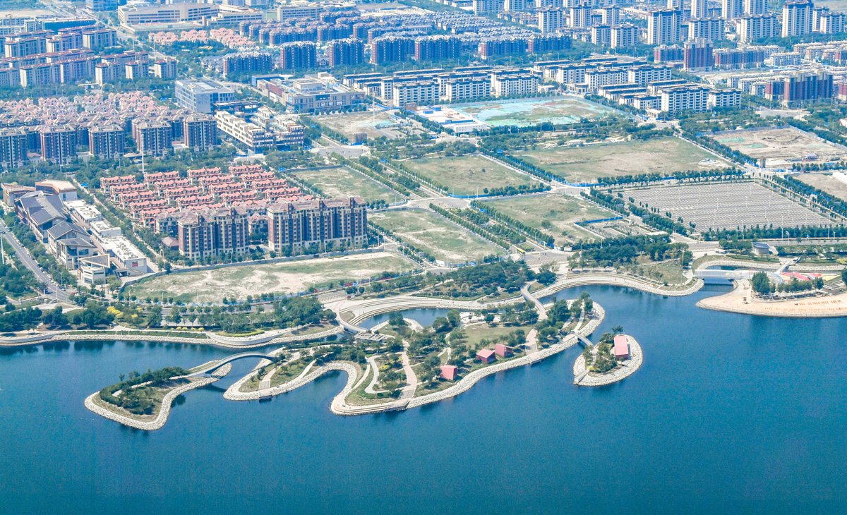 XHNews's tweet photo. China-Singapore Tianjin Eco-City turns urban living into a climate solution: underground waste pipes, 100% green buildings, solar-powered factories, cooler summers, and ecosystem value tracked like GDP. Find out more: https://t.co/RpjmZEStTz #EcoCity #SustainableUrbanism #ClimateAction