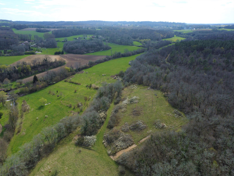 TimurNegru's tweet photo. A Parisian couple are selling an entire hamlet, 6 stone buildings, 10 separate living spaces, 24 hectares (60 acres) of land, 6 natural springs, a stream and a pond, all for €2M ($2.3M).

1,230m² (13,240 sq ft) of living space in total, 21 beds, 11 baths, meadows, woodland, two old stone quarries, sculptures around the grounds, buildings dating from the 16th century and even fiber optic.

They bought it in 1993 for €152k, spent 33 years turning it into a thriving arts community, running residential courses, festivals and artist residencies out of it. Now they're ready to hand it on.

There's a constant debate on here about what life looks like post-AGI. When AI does most of the work, what do people actually do with their time and who do they choose to spend it with?

I think places like this become part of the answer, your own land, your own water, space to grow food, make things and live physically alongside people you've chosen. And the more the world changes, the more that starts to make sense, no?