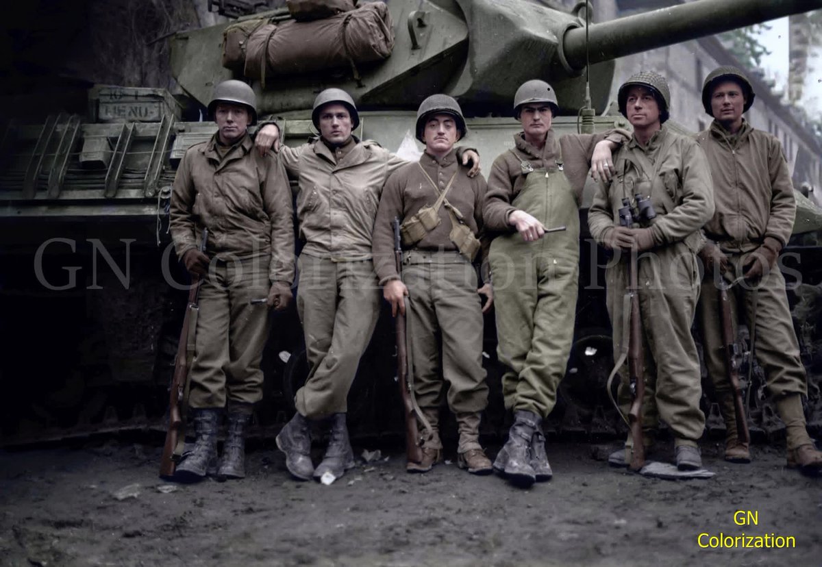 VoicesofWW2's tweet image. Members of the US 823rd Tank Destroyer Battalion, Company 'C' pose in front of an M-10, Belgium, 1944.