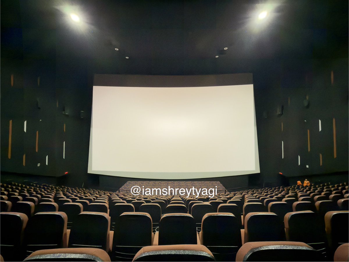 iamshreytyagi's tweet photo. Screen 6 (PCX), Prasads Multiplex, Hyderabad - India’s 2nd widest cinema screen

This is a 98.6 ft × 64 ft wide screen because it is installed at a venue which previously had a giant 1.43:1 IMAX screen! The actual screen if 101.6ft wide but since you need to curl some of the screen behind the frame to ensure it’s tight, the effective width is 98.6ft. Since it was earlier an IMAX, it also has that extremely steep IMAX seating and only 14 rows! Due to this, even from the last row, almost your entire field of view will be covered by the screen. If you decide to sit somewhere in the middle like me, it is like a VR experience. Such a grand feeling elevates every movie you watch.

It’s not just the scale, but also the technology. They use the same flagship dual 4K laser projector system which is used in all digital 1.43:1 IMAX venues in the world. The result is that despite being such a massive screen, the image stays bright and detailed. Not only does the projection match the recommended brightness of 14 fL, but they keep it a couple of fL even brighter to make the experience better.

The interiors are fully black; the walls, ceilings, as well as the carpet are black. The seats are deep red. This helps in keeping the picture’s black levels deep, and the audi stays dark, which improves the immersion.

There is a unique thing about this screen, its aspect ratio, which happens to be 1.54:1, a non-standard screen aspect ratio. What this causes is that the projector cannot cover the entire height of the screen even if there is content of that ratio available. It maxes out at 1.90:1. One benefit of this is that there is no cropping of images at the edges. Because otherwise, every projector that fills the screen entirely has to do some image cropping to ensure the image looks clean on edges. That problem doesn’t happen here, and you see a 100% full image. Since the screen is tilted slightly upwards, the image could look skewed if the projected image is not offsetting the screen tilt. So, yes, the picture is keystoned, which is why the image covers almost the entire screen width at the top area, but the bottom part of the projected image covers lesser width. This makes the image look like a trapezium instead of a rectangle. But an important thing to note is that this is done to prevent the image from looking distorted. It is better this way.

This screen uses Dolby 3D technology with CAT8461L-BAR3 Dolby3D glasses, which is the best 3D technology in the world… the same as what Dolby Cinema also uses. For 3D, this venue is the perfect way to get immersed.

The sound is powered by a CP950A Dolby Atmos Processor paired with QSC surround speakers and Krix stage speakers (behind screen). There are 22 surround speakers and 14 atmos height channel speakers. There are 16 dual box subwoofers (18"). They all work together to provide thunderous Dolby Atmos system with powerful, heart-pounding bass. If you sit at the right seat, the Atmos sound feels so natural that you’d feel everything really is happening around you. Due to the huge size of the audi, the surround sound travelling around you feels much more exciting than it does in standard auditoriums. Since the screen is so wide, even the stereo separation in stage speakers is very noticeable.

Generally, bigger auditoriums make it tough for the bass to stay tight and clean. But the acoustic treatment is done very well here, using an advanced technology called “glass wool”, which further makes the sound as good as it can get. Glass wool is an insulating material made from glass fiber arranged using a binder into a texture similar to wool.